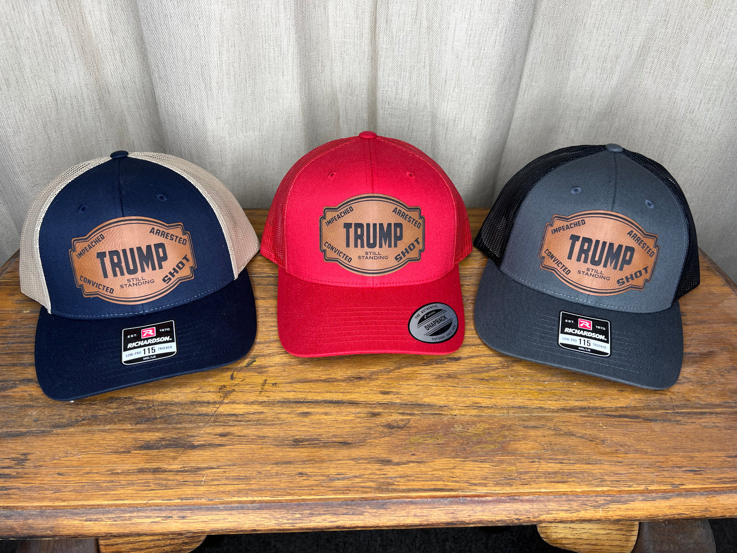 Trump still standing hat