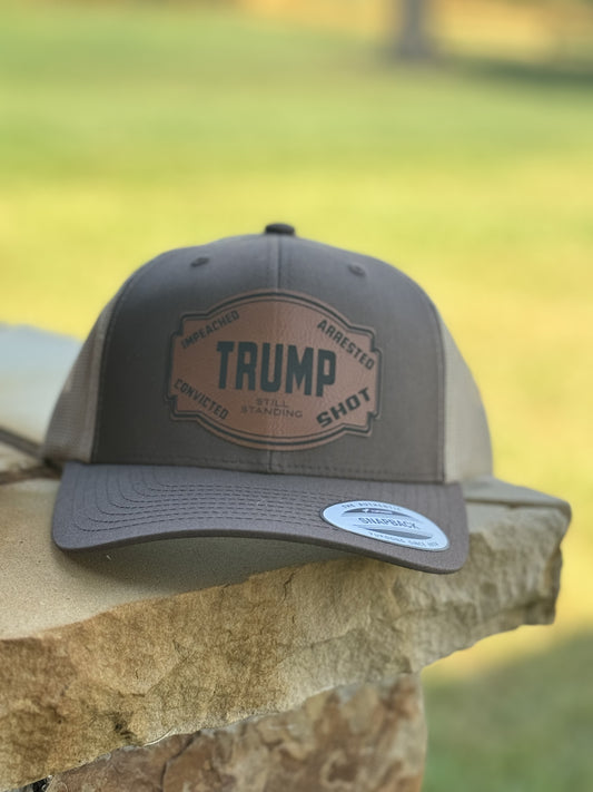 Trump still standing hat